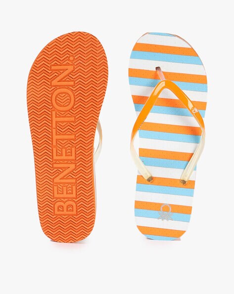 Orange and blue store flip flops