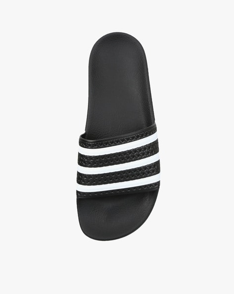 Black and 2025 white adilette slides