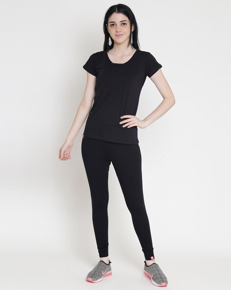 Side View of Standing Woman in Black Leggings, High Heels and Oragne Shirt  with Arms Crossed Stock Photo - Image of young, leggings: 126703118