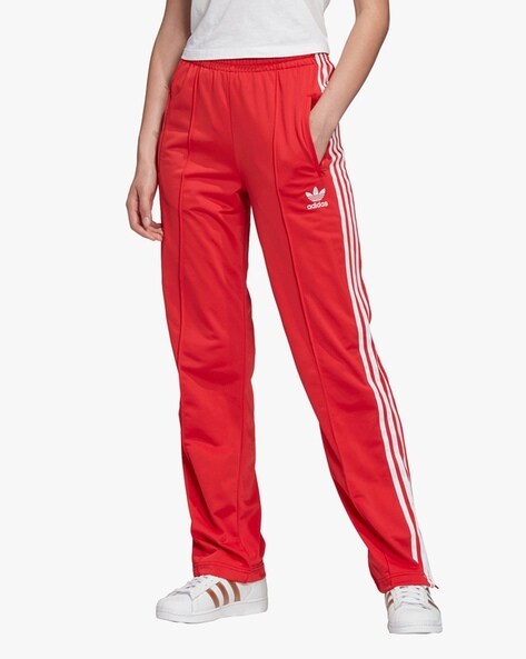 Style it sporty like Jenna Coleman in red stripe track pants by Adidas   MailOnline
