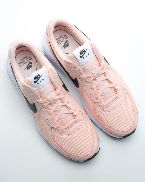 Peach store nike trainers