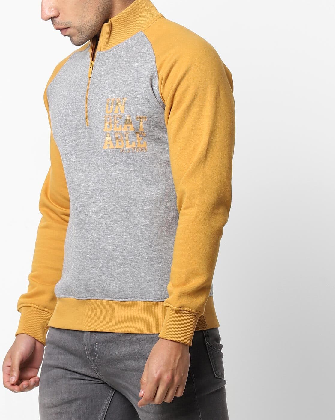 grey and yellow sweatshirt