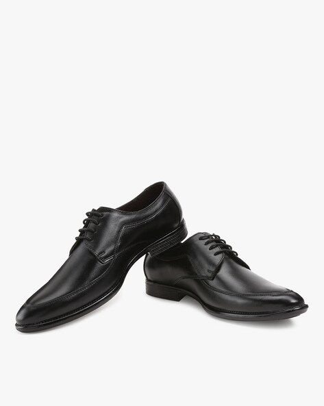 black dress shoes with white stitching