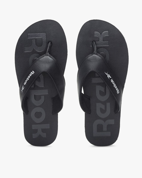 Black reebok hotsell flip flops