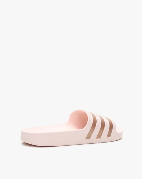 Adilette aqua best sale slides pink tint