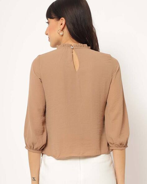 beige high neck top