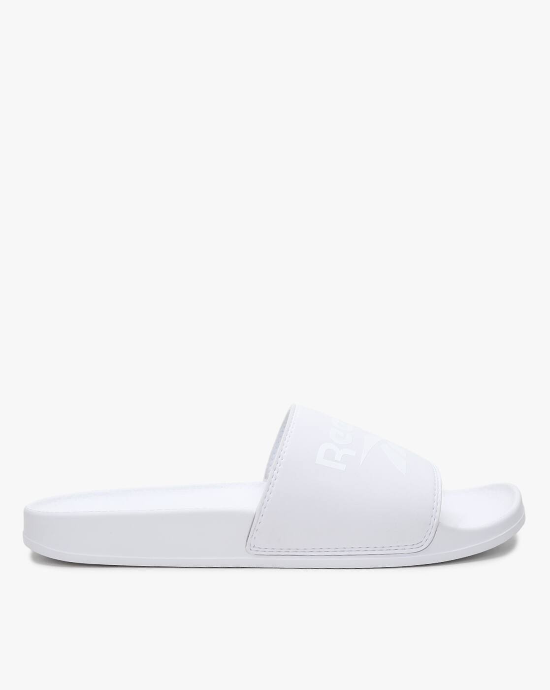 white reebok slides