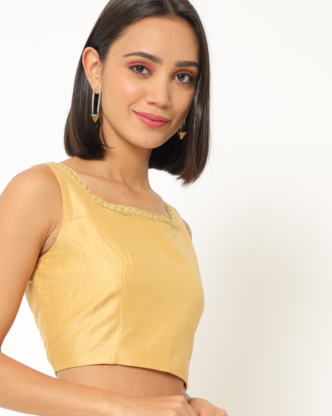 gold sleeveless crop top