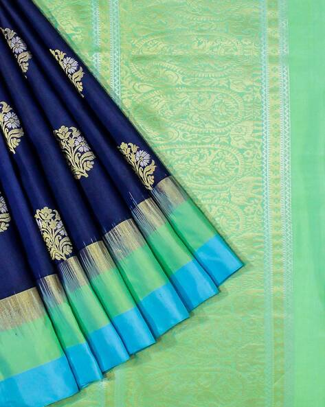 Borderless blue soft silksaree with round-shaped buttas, contrast pallu of  rudraksha, paisley, floral vine & chevron