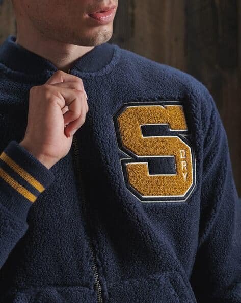 sherpa varsity bomber jacket