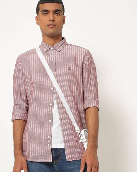 maroon shirt with white buttons