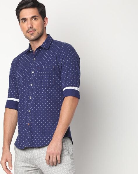 navy blue shirt with white polka dots