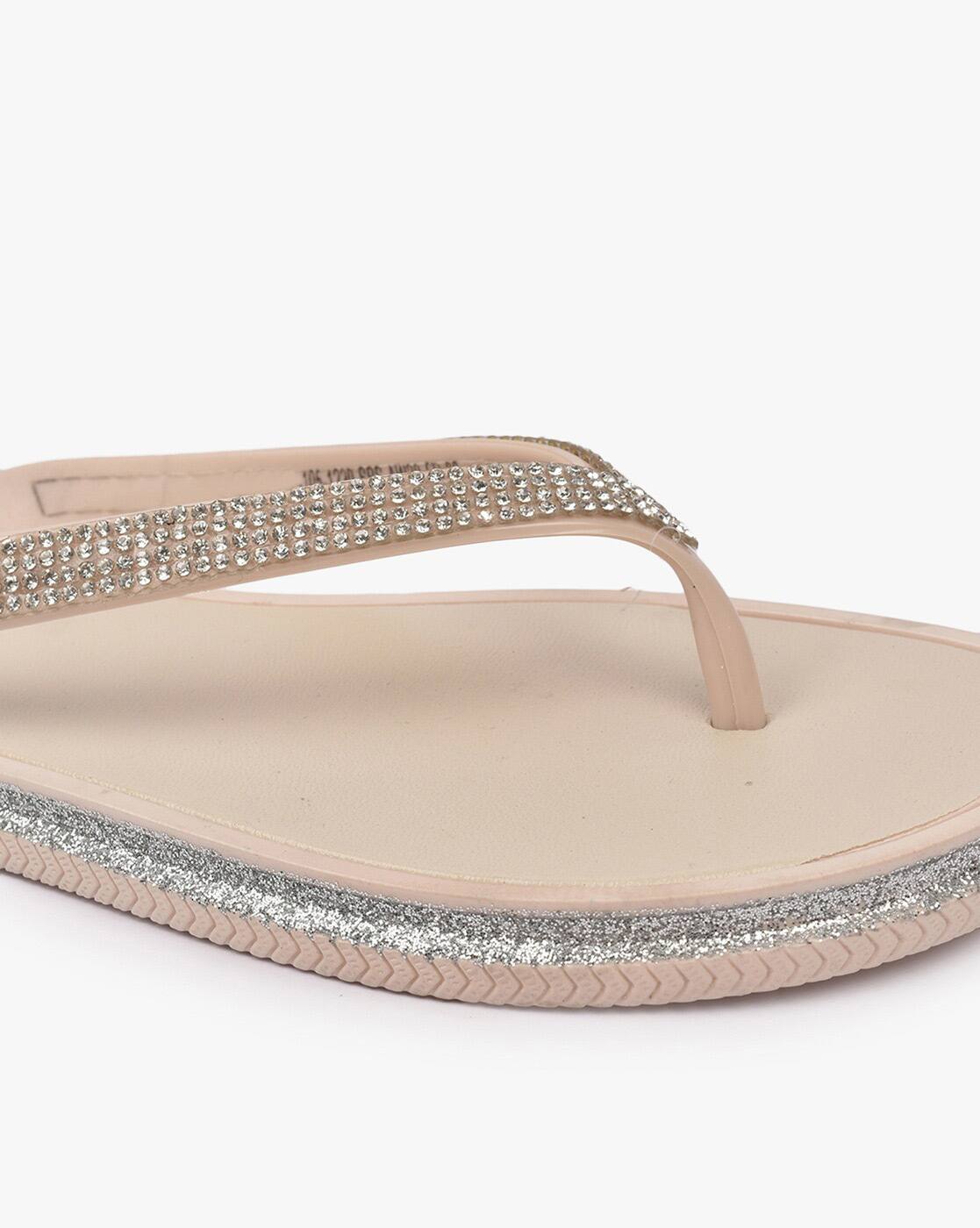 nude women in flip flops