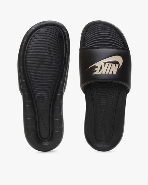 Nike black and gold 2025 sliders