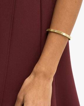 Buy KATE SPADE Infinite Engraved Spade Bangle Gold Toned Color