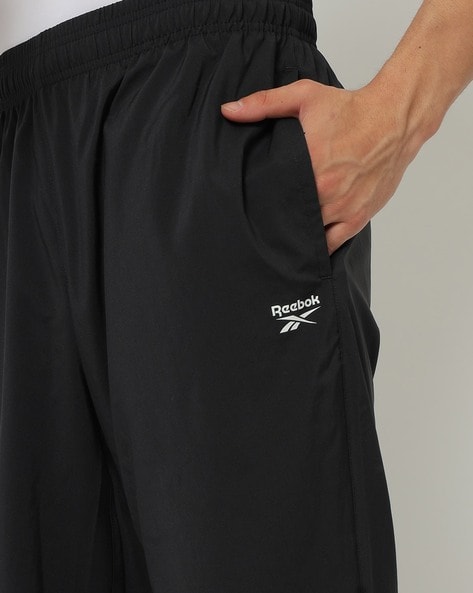 Buy Reebok Drawstring And Elastic Waistband TE Jersey Track Pants Black In  Black
