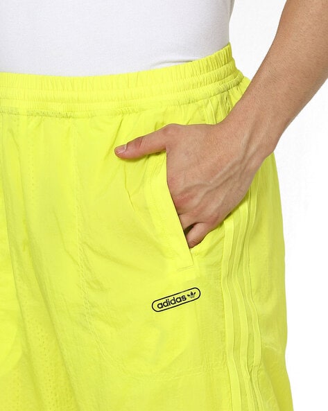 Yellow adidas track on sale pants