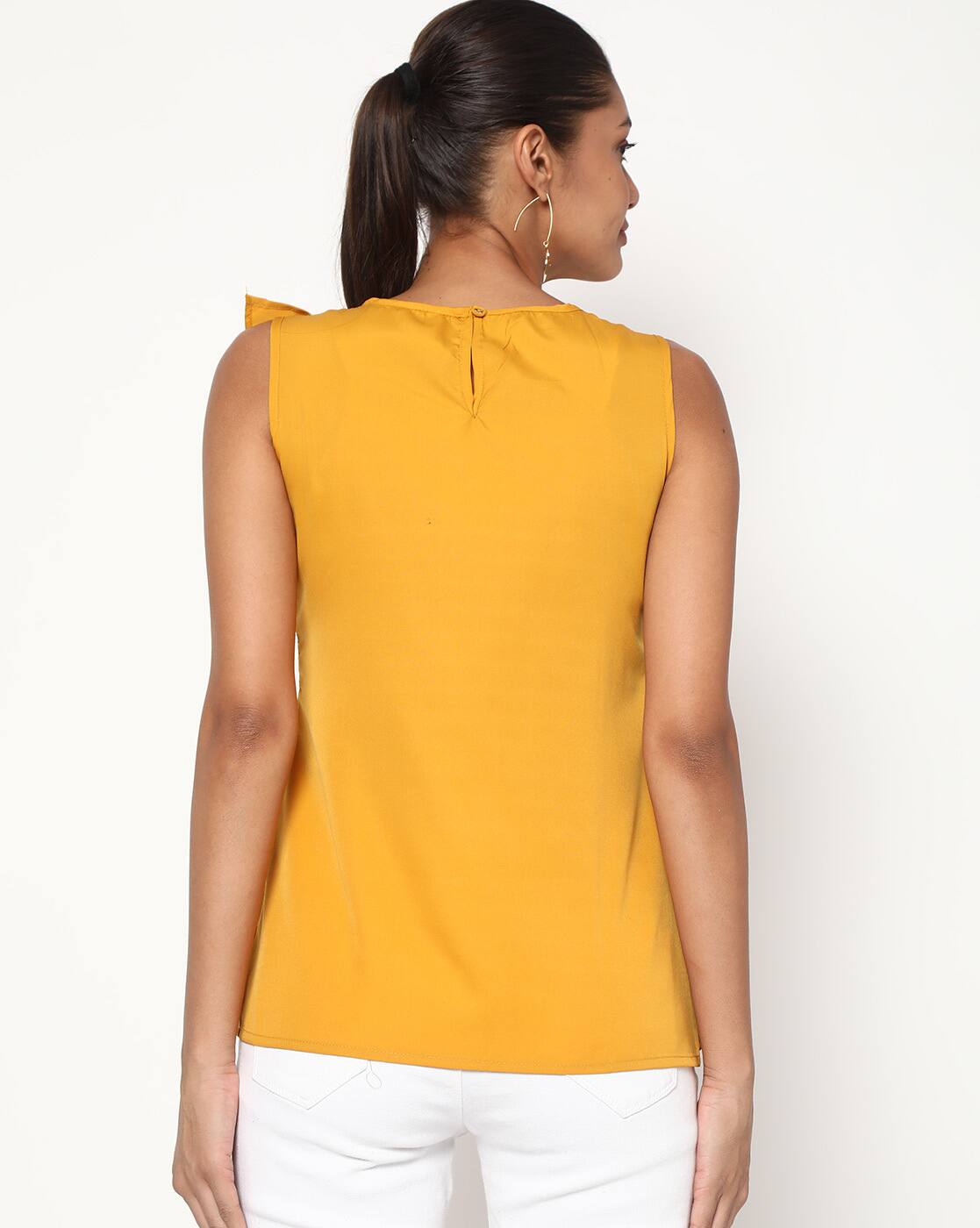 mustard yellow sleeveless top