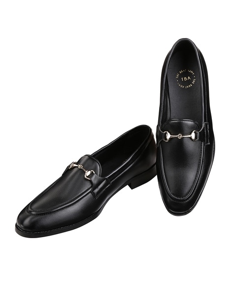 black dress shoes with gold accents