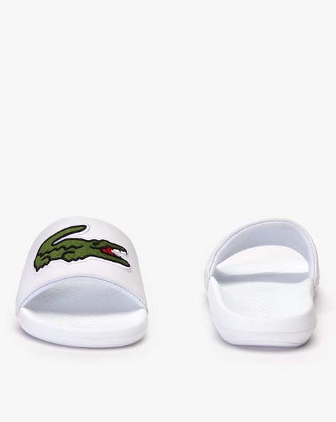 Lacoste best sale white sandals