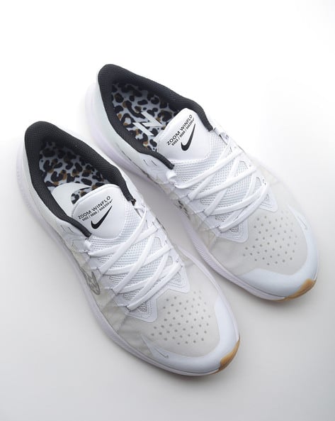 White Sports Shoes for Women by NIKE 