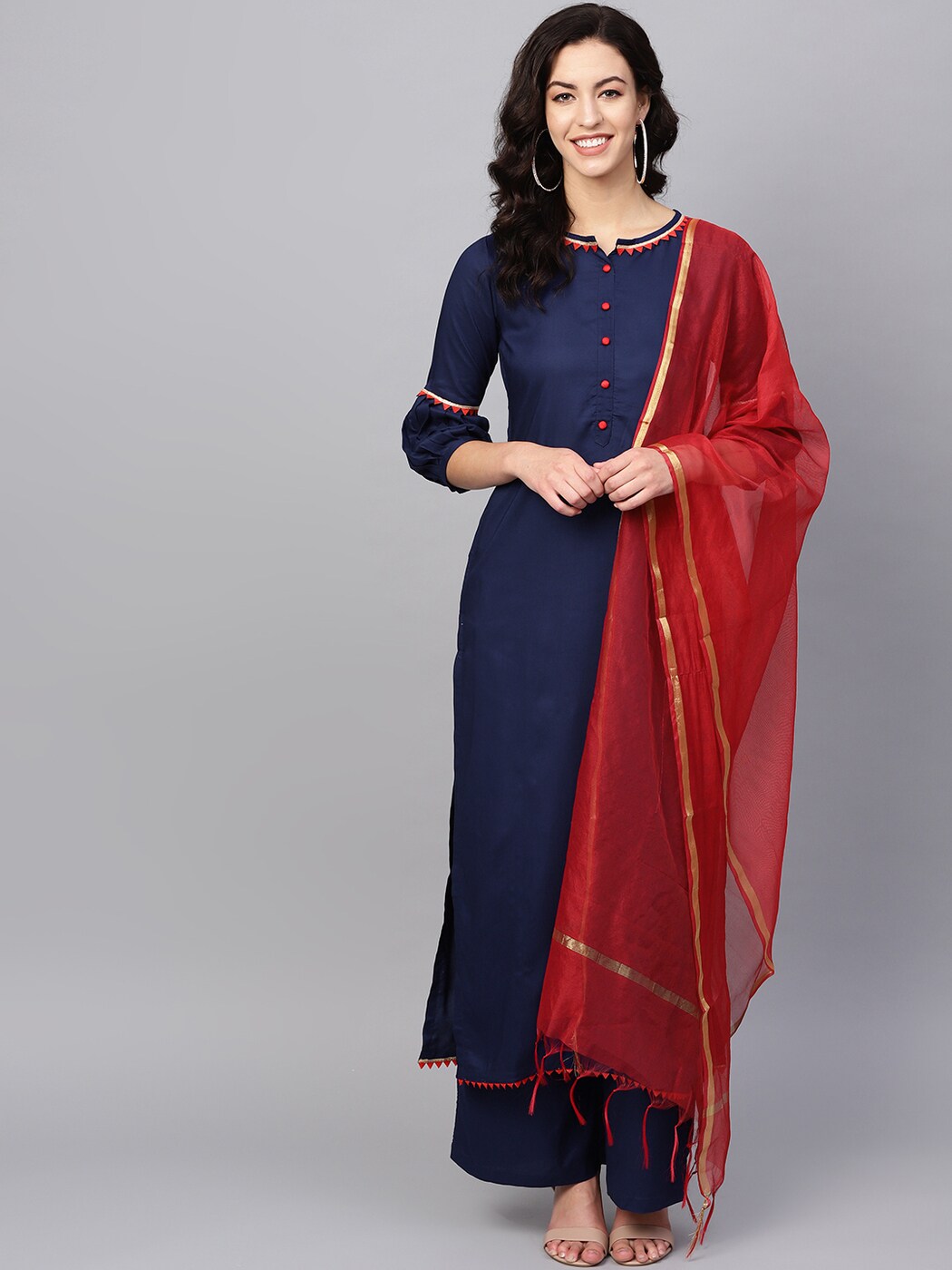 navy blue suit with red dupatta