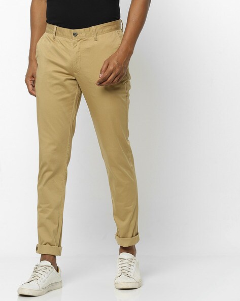 Buy Celio Men Khaki Solid Skinny Fit Regular Trousers on Myntra |  PaisaWapas.com