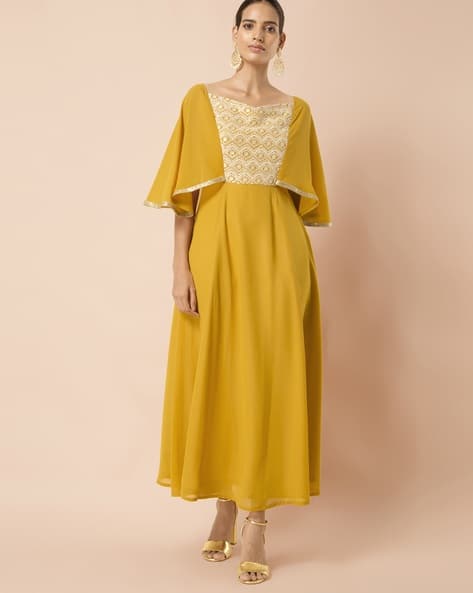 yellow dress with cape