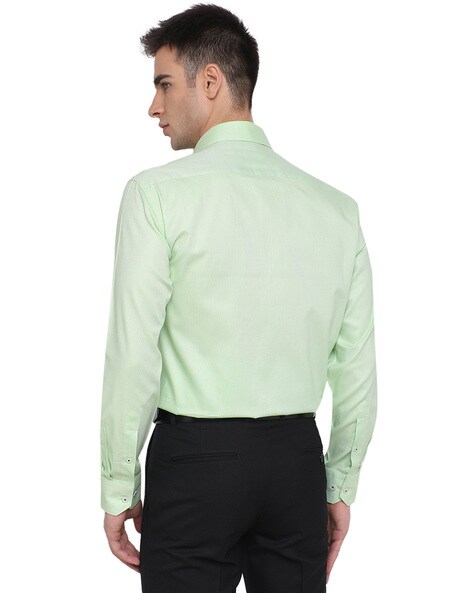 light green shirt black pants