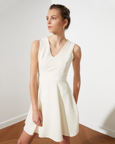 white sleeveless skater dress