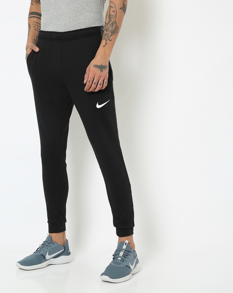 Buy black Track Pants for Men by NIKE Online