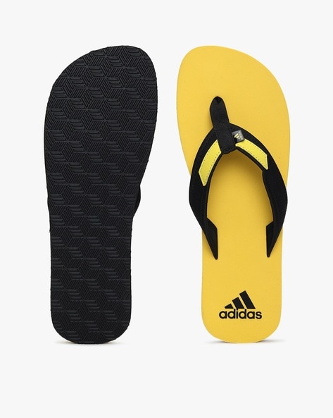 Black and sales yellow flip flops