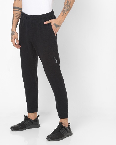 Nike Yoga joggers in dark grey