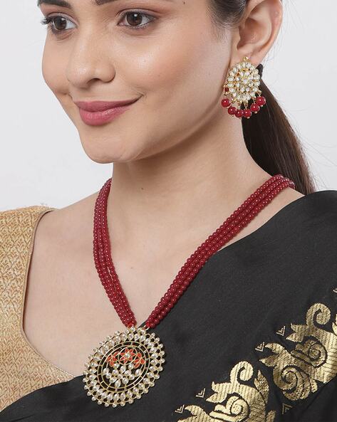 Maroon Pearl Kundan Jhumki Earring | FashionCrab.com