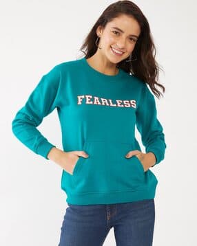 white sweatshirt with green writing