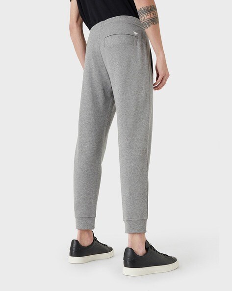 Nike Monogram all over logo print fleece cuffed sweatpants in black