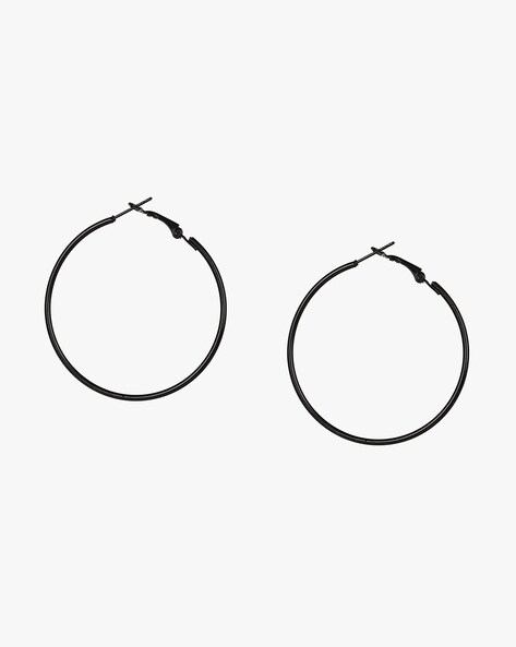 Tiffany T black onyx circle earrings in 18k gold. | Tiffany & Co.