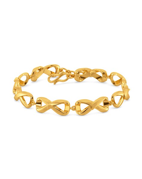 Joyalukkas - This bangle style gold bracelet has a... | Facebook
