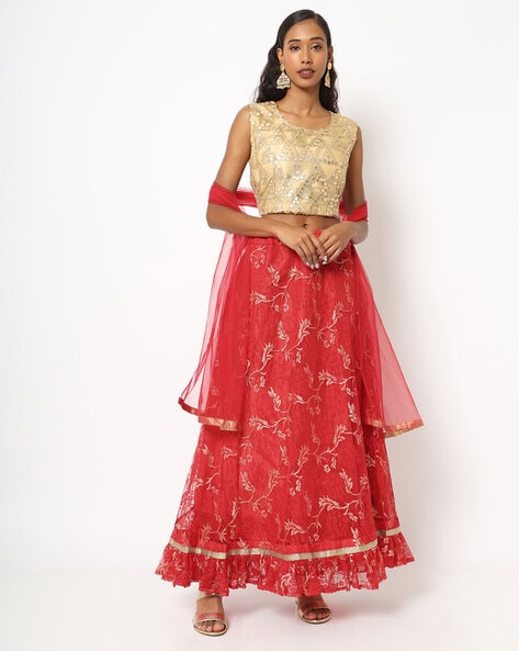 Cream lehenga matched with maroon cape