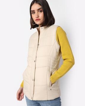 beige sleeveless jacket