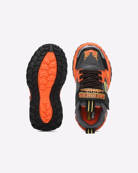 Orange and cheap black skechers