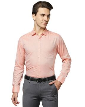 peach shirt grey pants