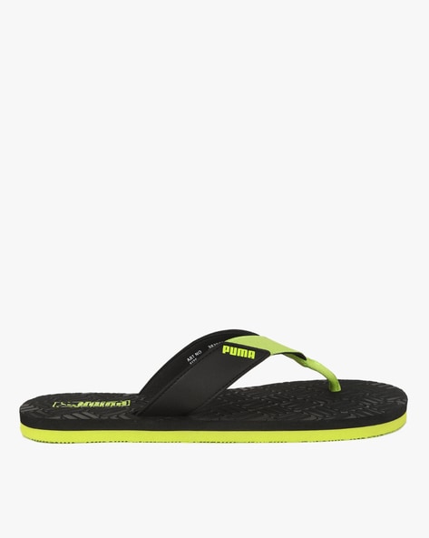 Puma black and 2025 green flip flops