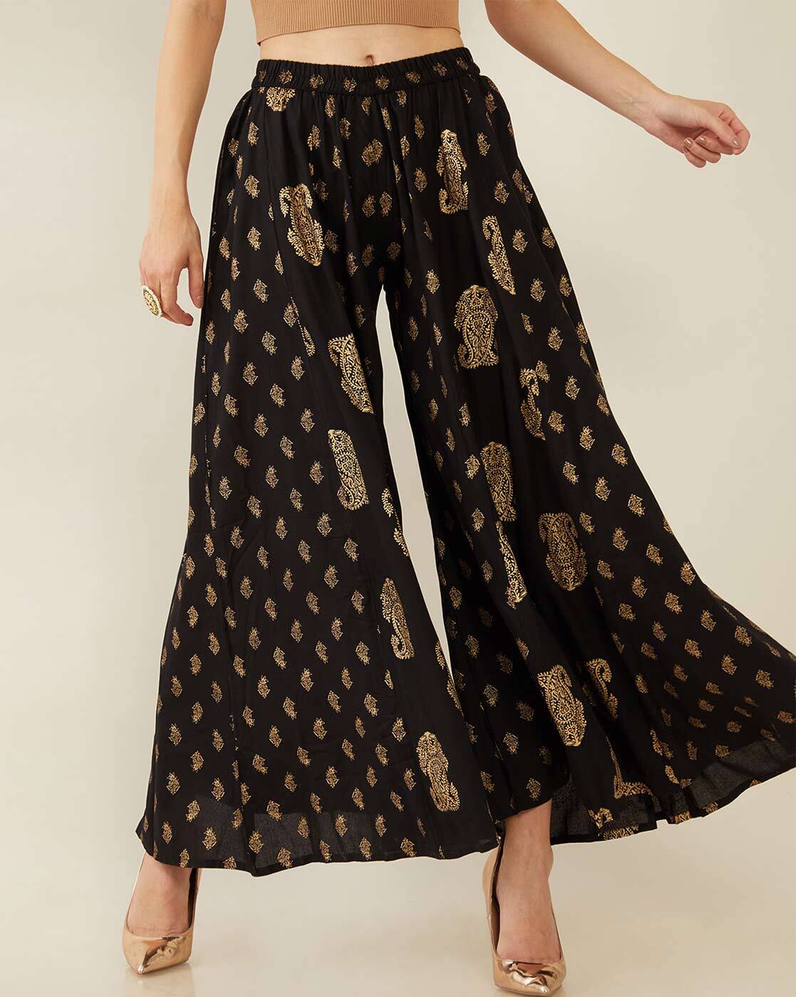 Cool baba wide pants tightened at the ankles by a smocked elastic at the  waist