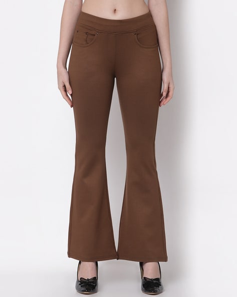 Premium Photo | Trousers or long pants hanging with wood hanger on wall