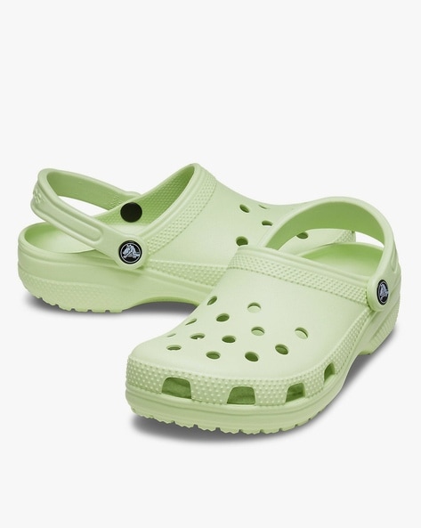 white crocs with green strap