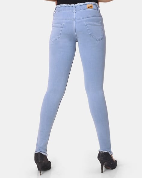 Lightly-Washed Skinny Jeans with Frayed Hems