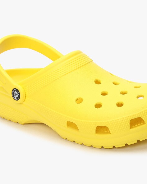 yellow and teal crocs