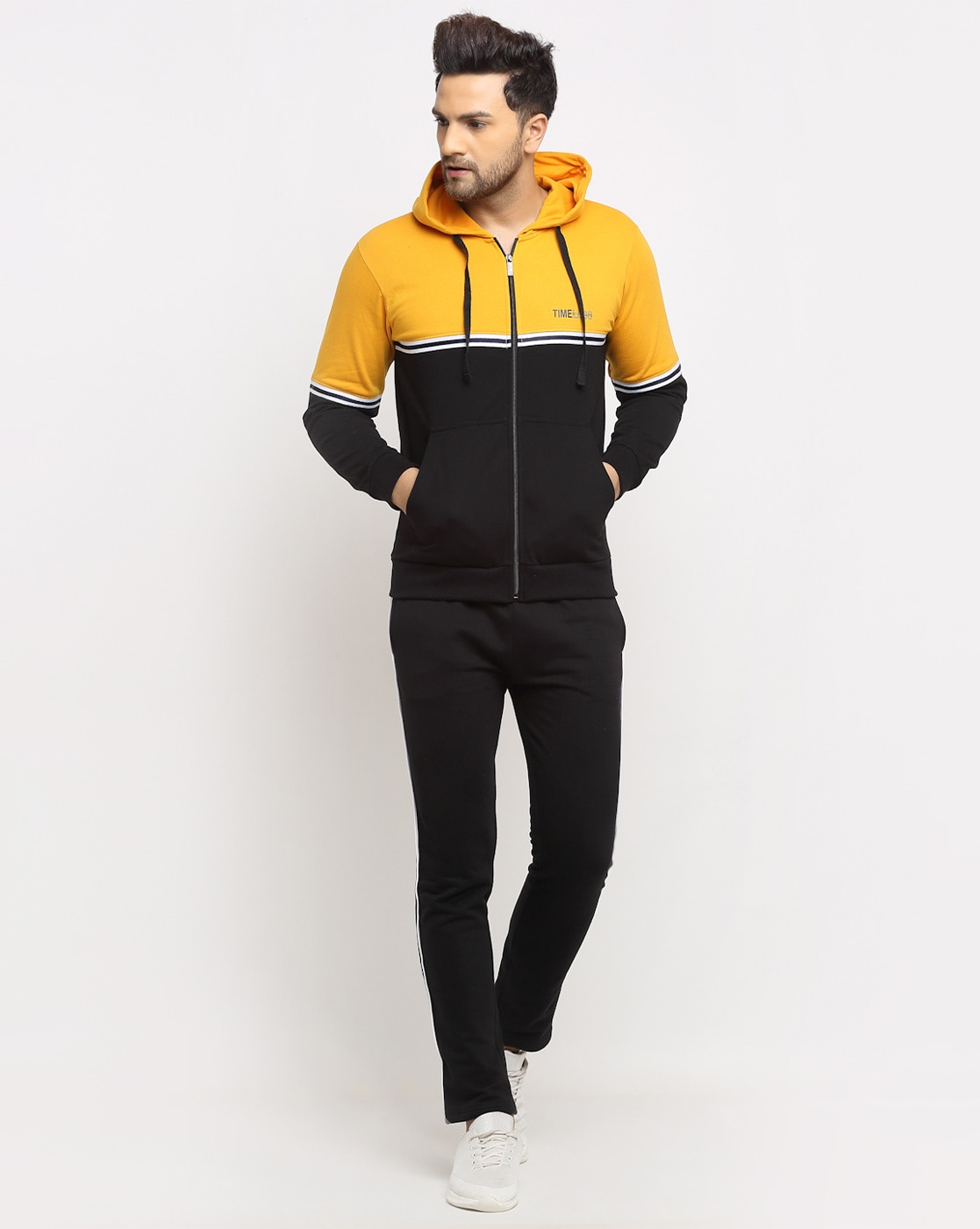 yellow and black jogging suit