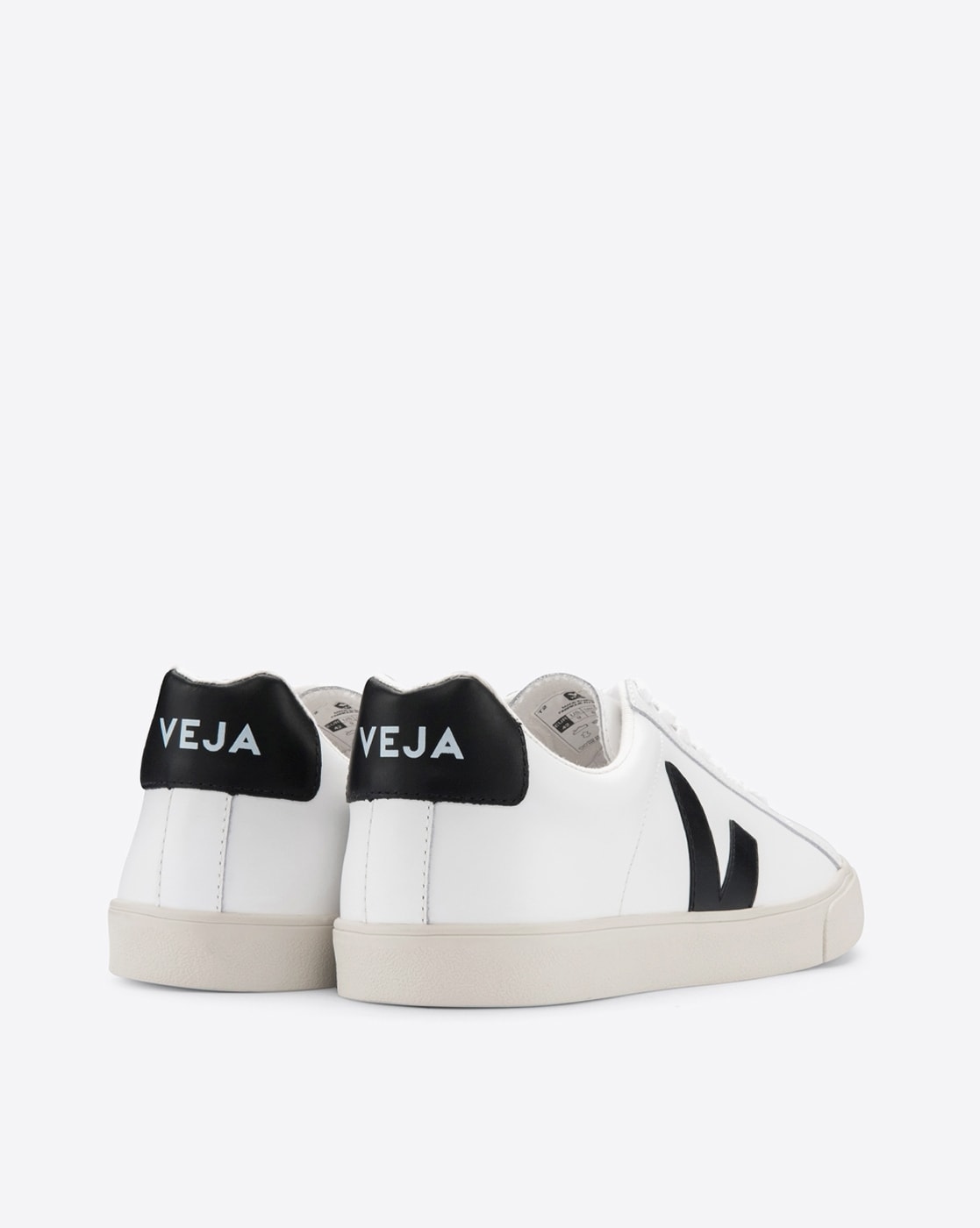 white and black veja trainers